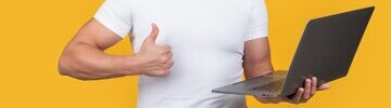 cropped-man-programmer-with-laptop-show-thumb-up-isolated-yellow-background-man-programmer_474717-100795.jpg
