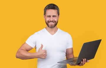 man-programmer-with-laptop-show-thumb-up-isolated-yellow-background-man-programmer_474717-100795